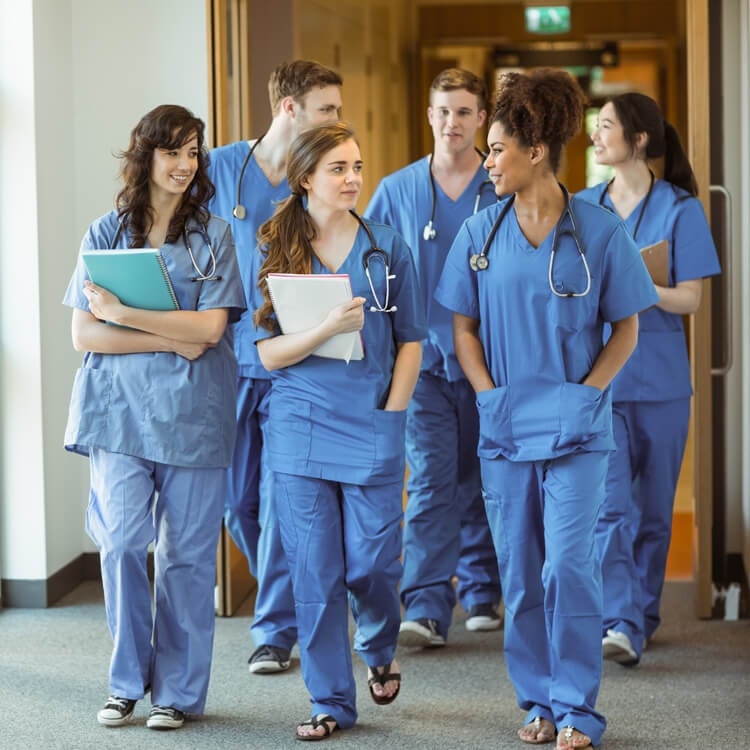 Group of nurses talking after class.