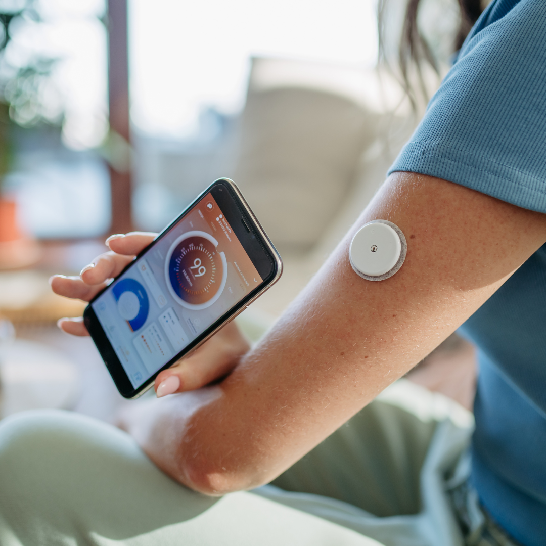 Continuous glucose monitor and smartphone.