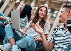 Happy students studying together