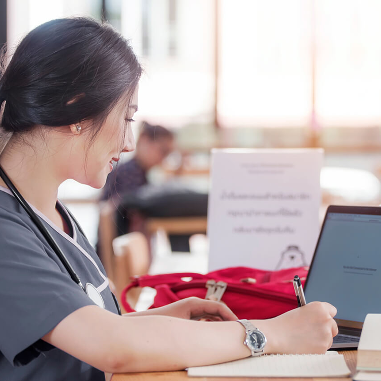 Nurse working on laptop.